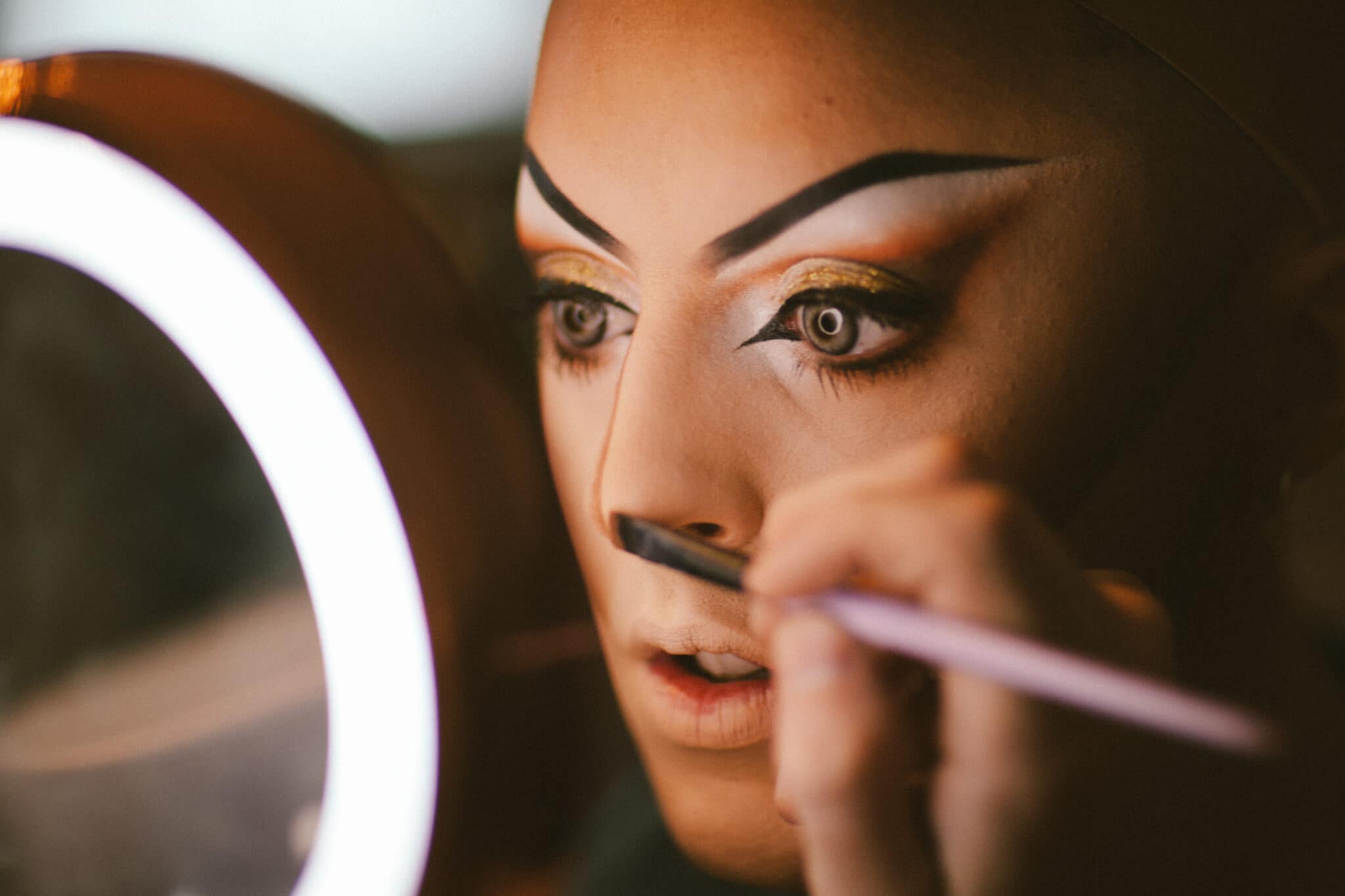 Cherry Valentine applies her makeup