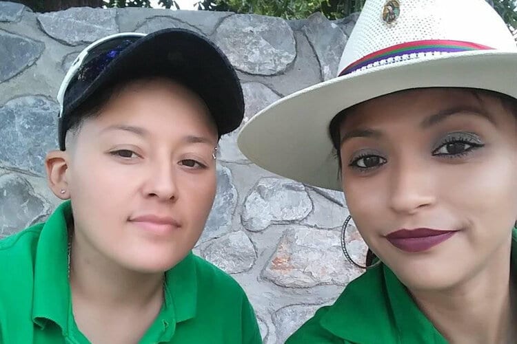 Horrified protesters demand an end to violence after barbaric murder of young lesbian couple