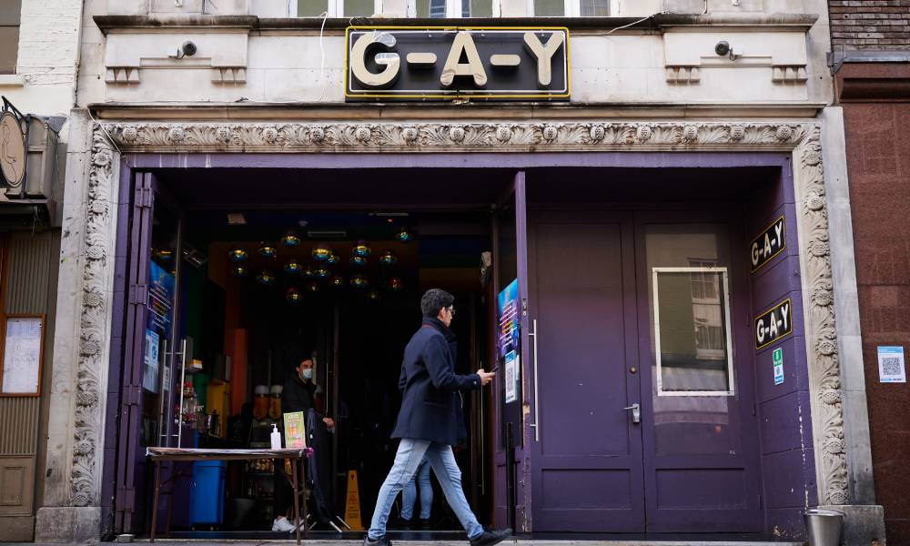 A person walks past the G-A-Y gay bar venue in London, England.