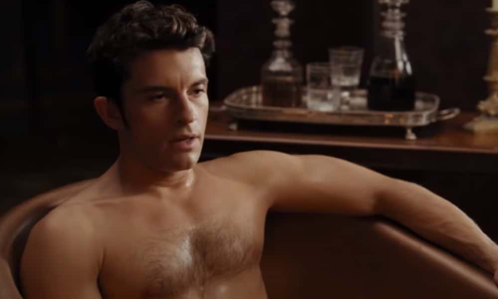 Jonathan Bailey shirtless in a bathtub