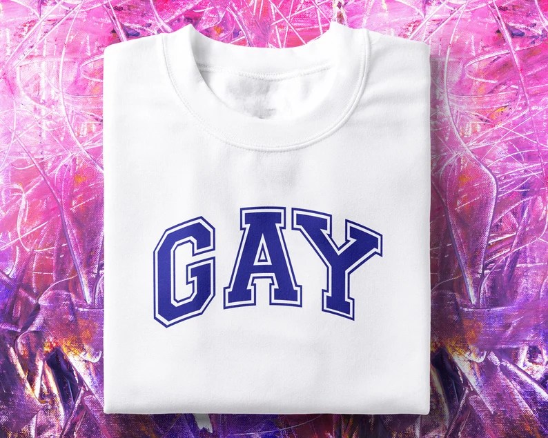 A 90s-style t-shirt that says &quot;GAY&quot;. (TheInternetClubUK/Etsy)