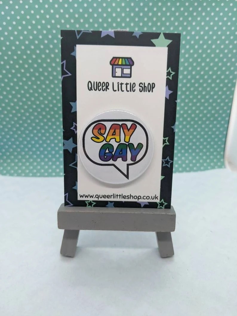 A &quot;Say Gay&quot; badge&quot;.