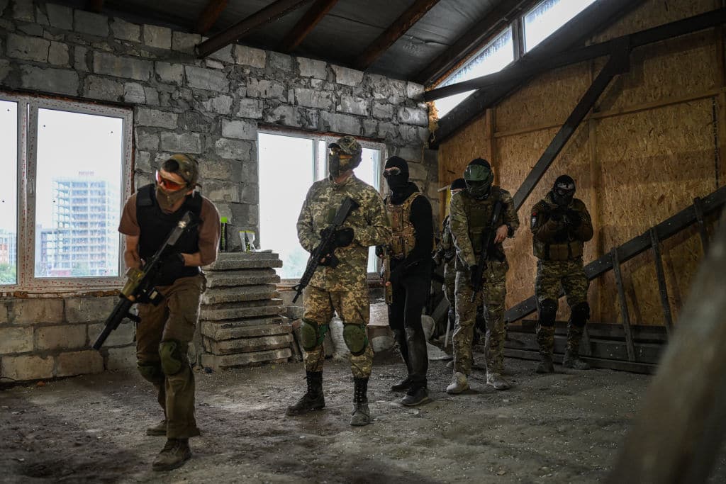 Ukrainian civilians practice with airsoft guns during an urban military tactical training to defend their cities in Lviv.