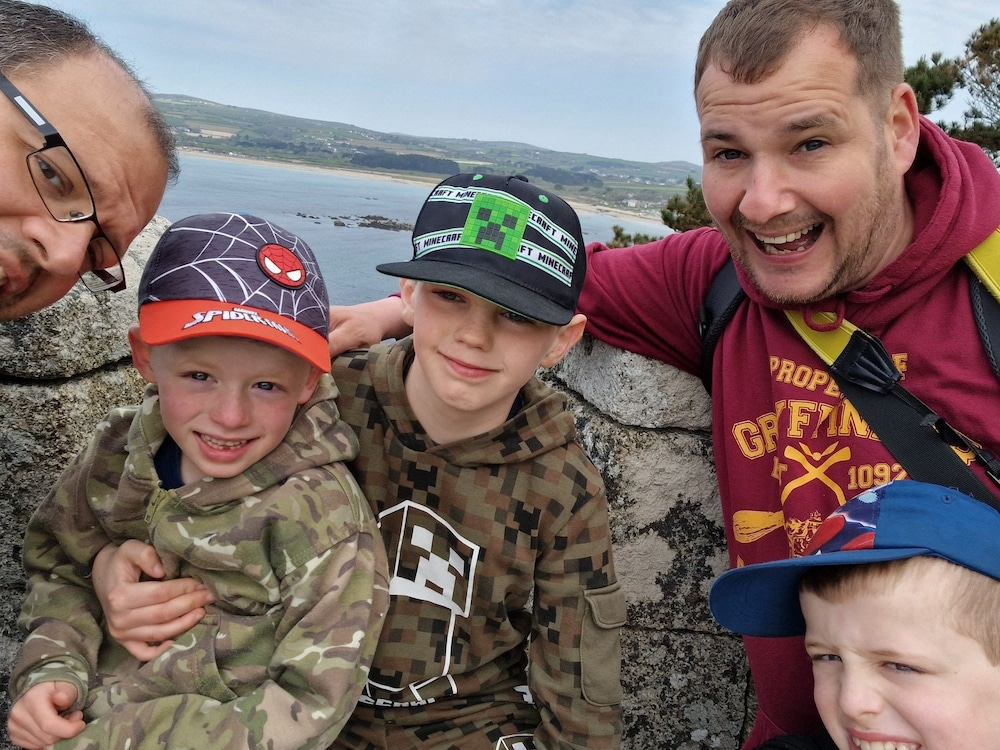 Phil (L) and Chris (R) with their three son