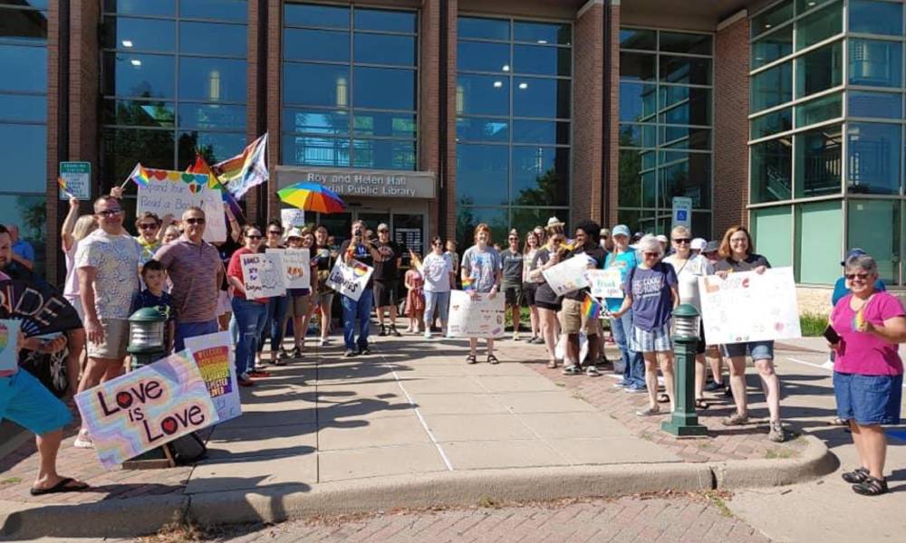 Proud Boys who targeted LGBTQ+ story time met with 'human shield' of LGBTQ+ love