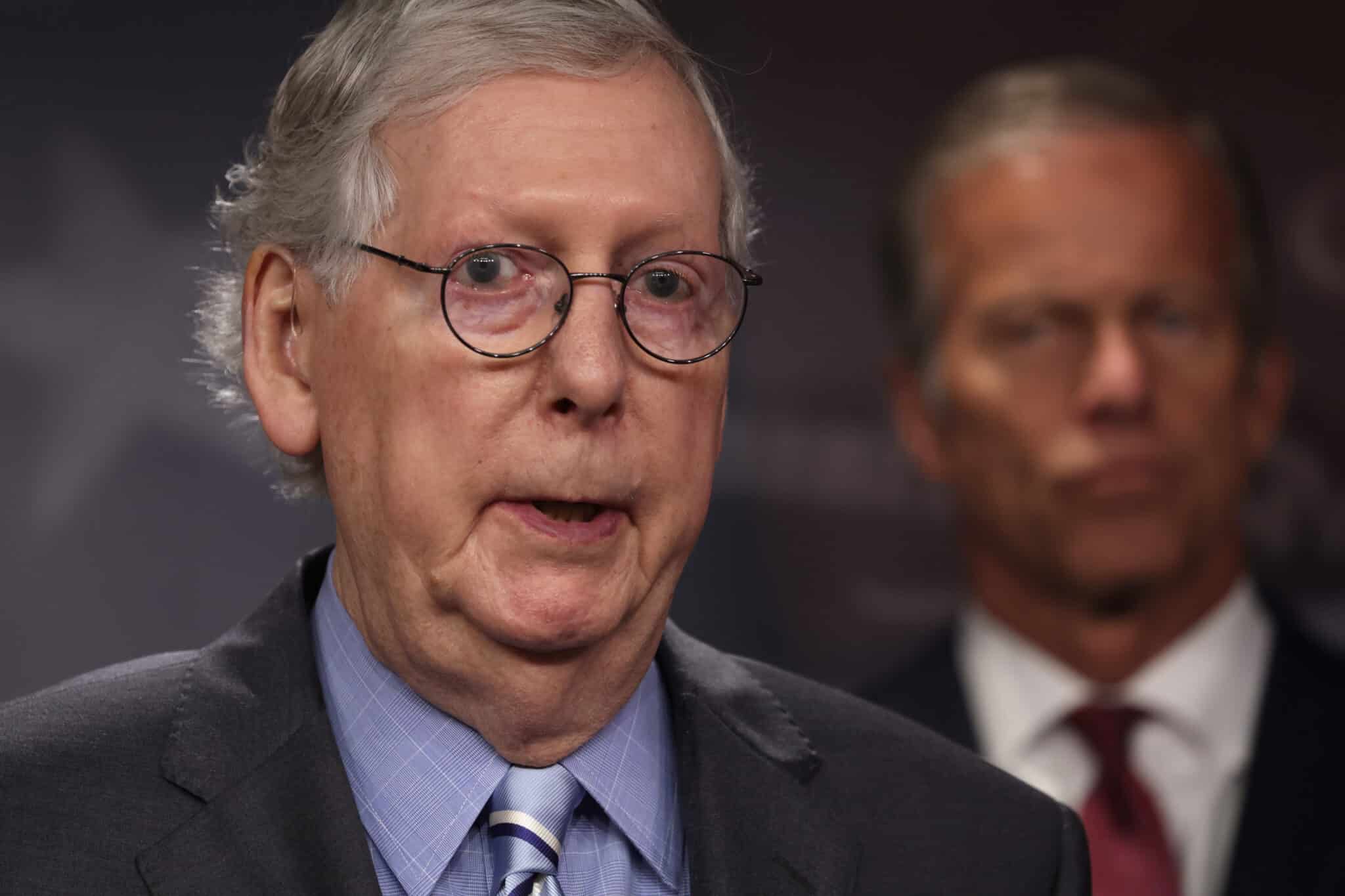 U.S. Senate Minority Leader Sen. Mitch McConnell (R-KY) (L) speaks as Senate Minority Whip Sen. John Thune (R-SD) (R) listens during a news briefing after a weekly Senate Republican policy luncheon at the U.S. Capitol on July 12, 2022 in Washington, DC.