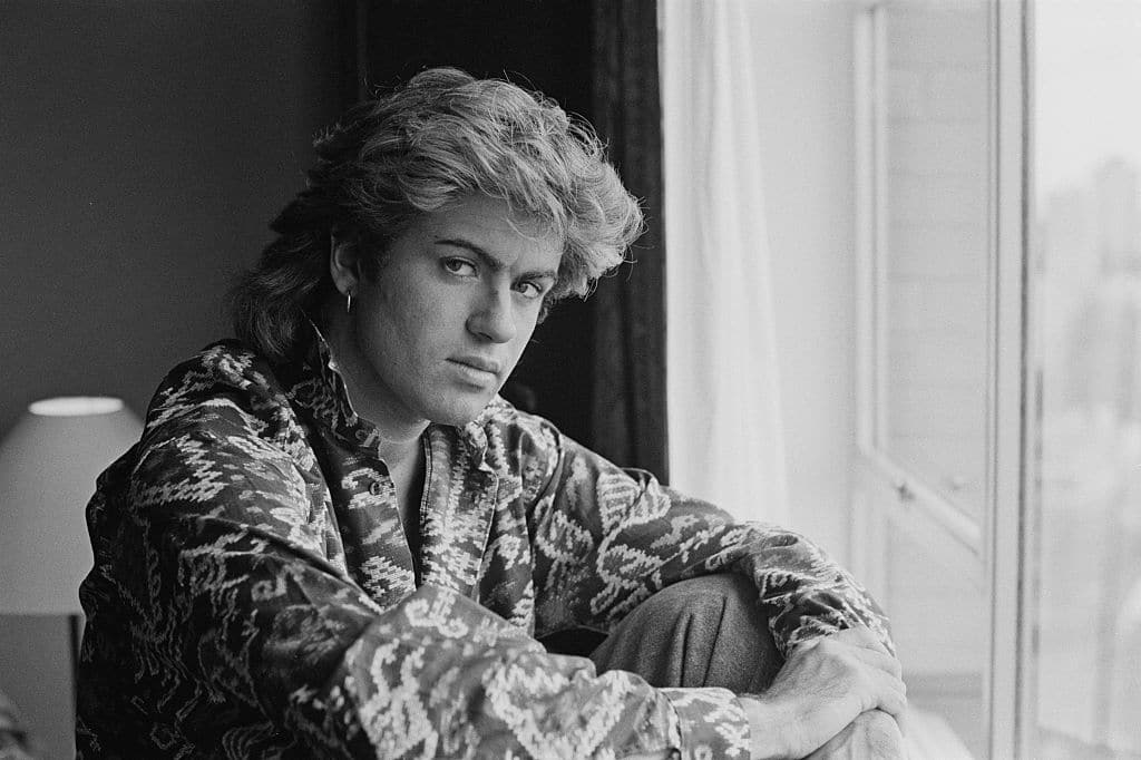 British singer-songwriter George Michael, of Wham!, in a Sydney hotel room during the pop duo