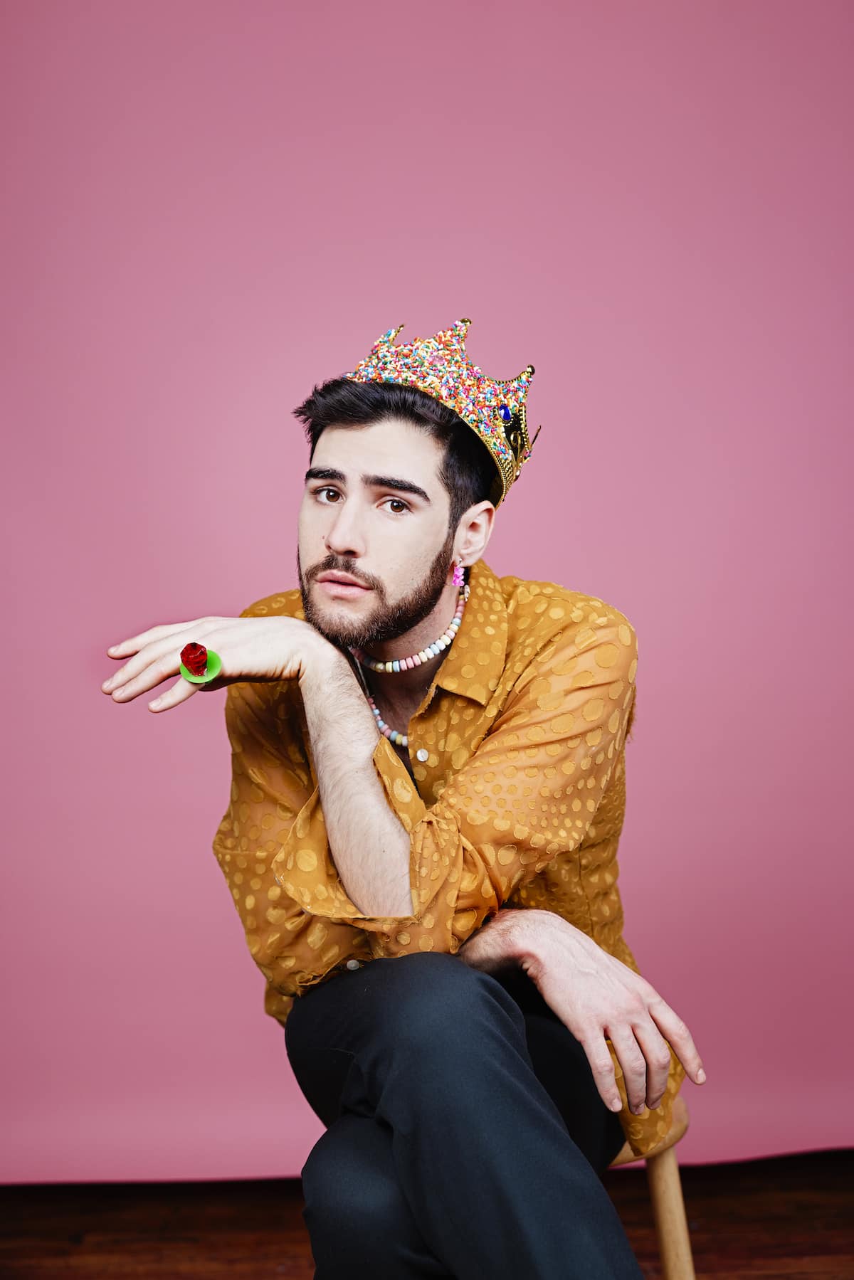 Sam Morrison against a pink background.