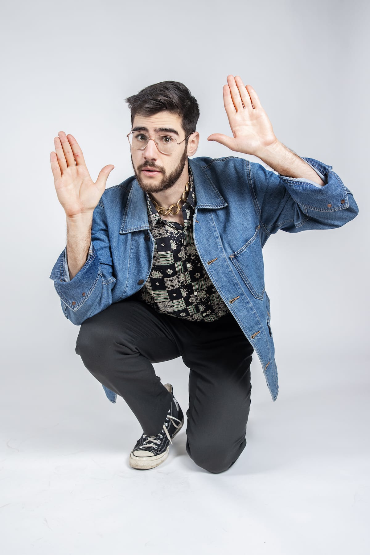 Sam Morrison wearing a denim jacket.