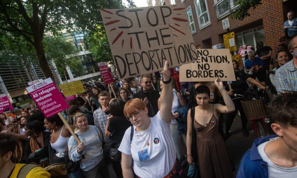 People protest against the UK Home Office for fighting to deport asylum seekers to Rwanda