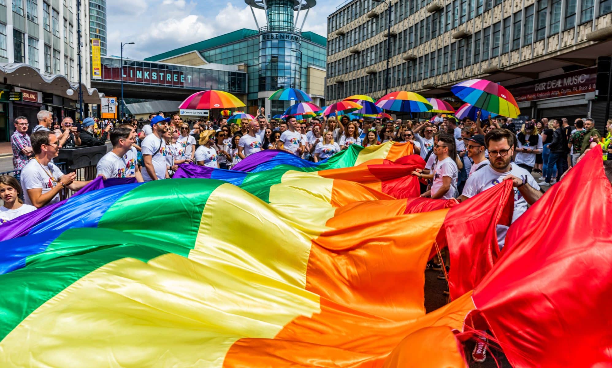 A Birmingham Pride procession goes through the city
