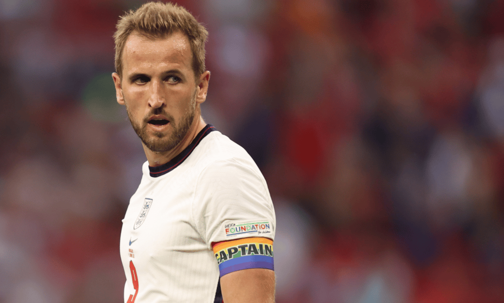 Harry Kane wears a rainbow captain armband during a match