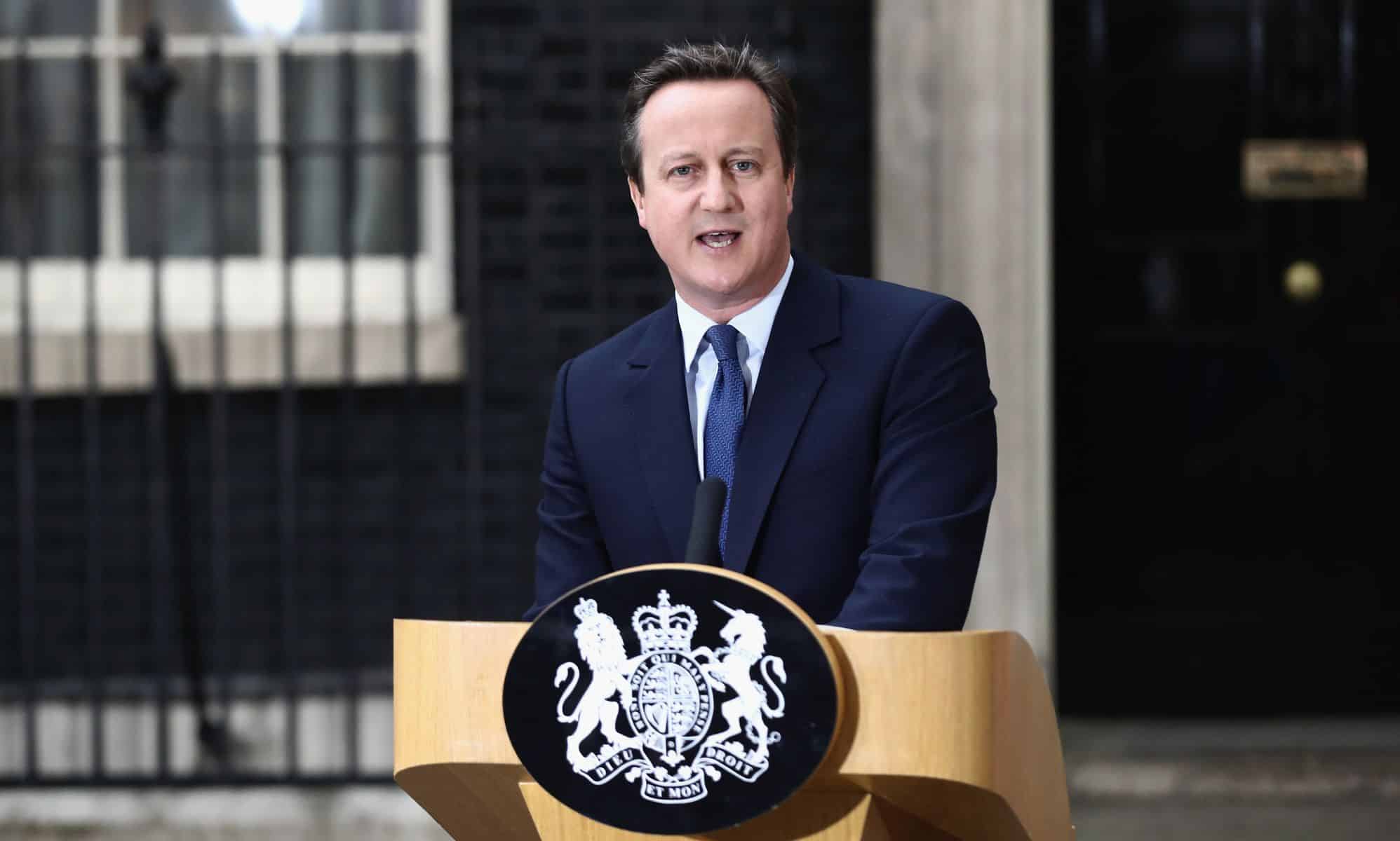 Prime minister David Cameron stands at a podium