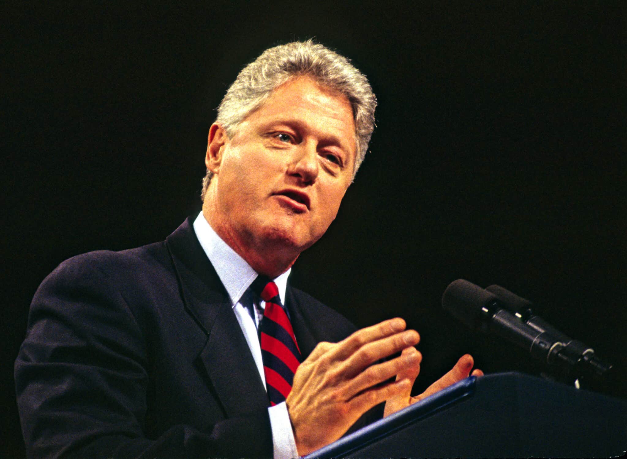 American politician US President Bill Clinton speaks from a podium at the Democratic Leadership Council