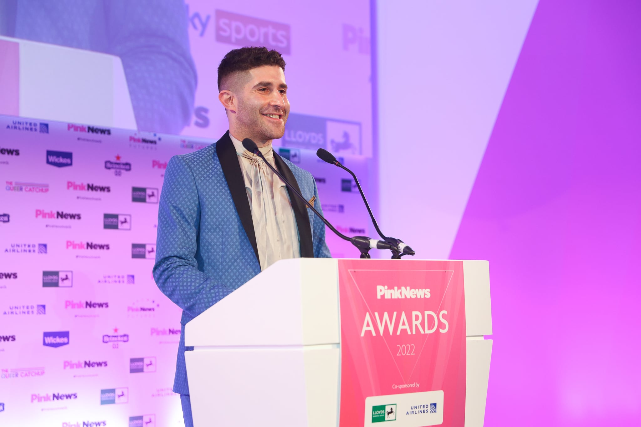 Ben Cohen speaks during the 2022 PinkNews Awards.