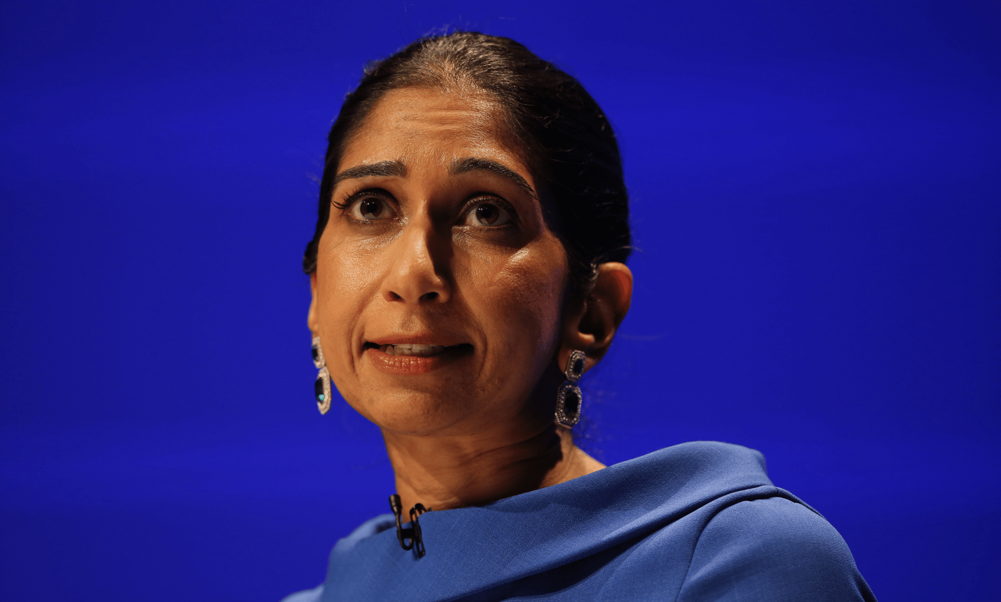 Home secretary Suella Braverman wears a blue outfit as she speaks at the conservative party conference