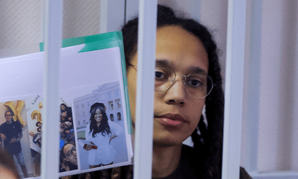 Brittney Griner holds photos inside a defendants