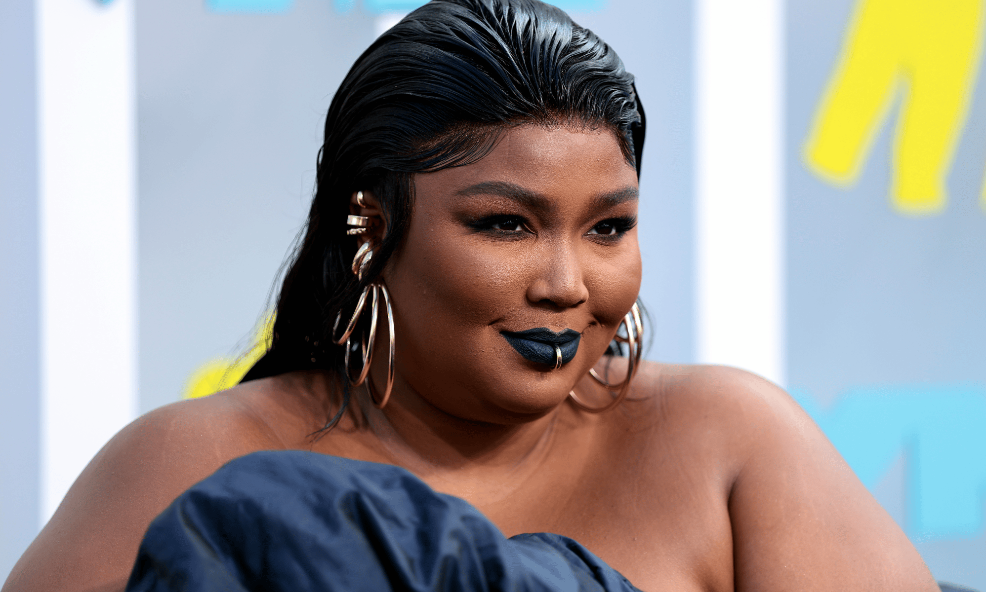 Lizzo explains why she said she doesn't believe in monogamy: 'Is it a religion?'