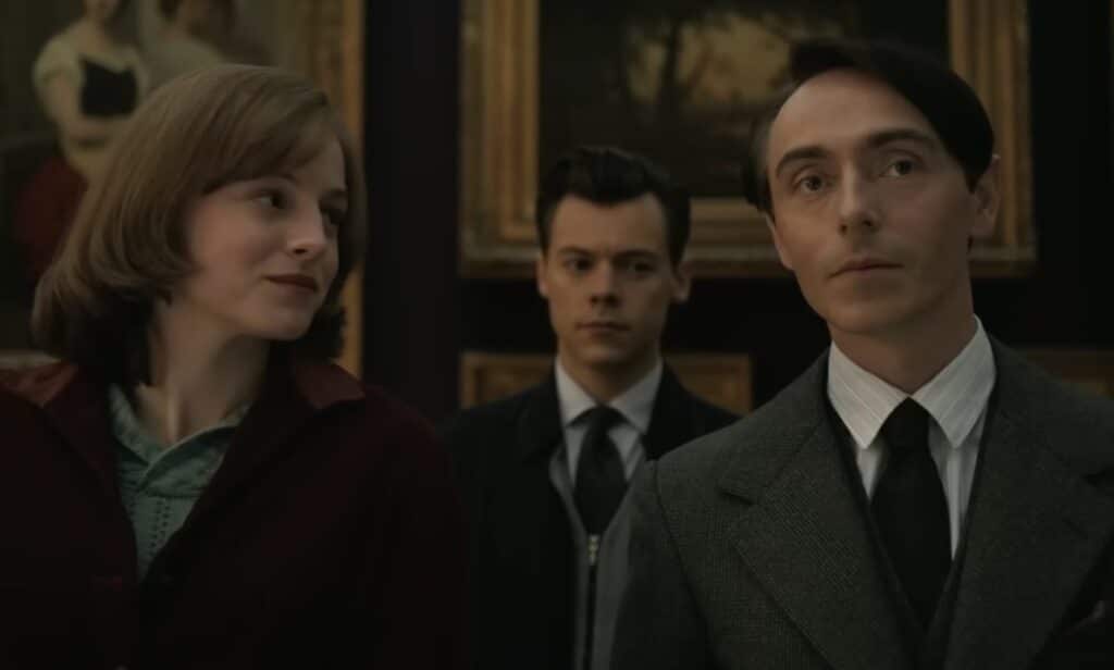 A still from the film My Policeman with actors Emma Corrin, Harry Styles and David Dawson.