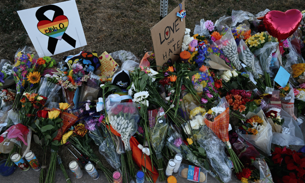 Flowers, signs, balloons and more are left at a makeshift memorial near Club Q on November 20, 2022 in Colorado Springs, Colorado after the LGBTQ+ venue was the scene of a mass shooting
