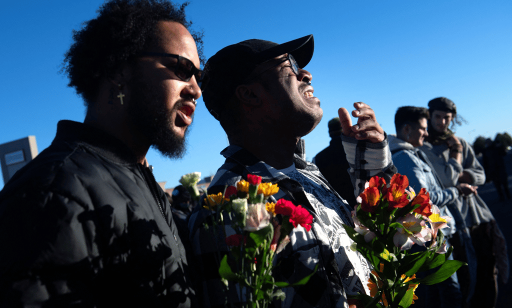 People have gathered near Club Q, an LGBTQ+ nightclub in Colorado Springs, Colorado, to honour and remember the victims in a mass shooting