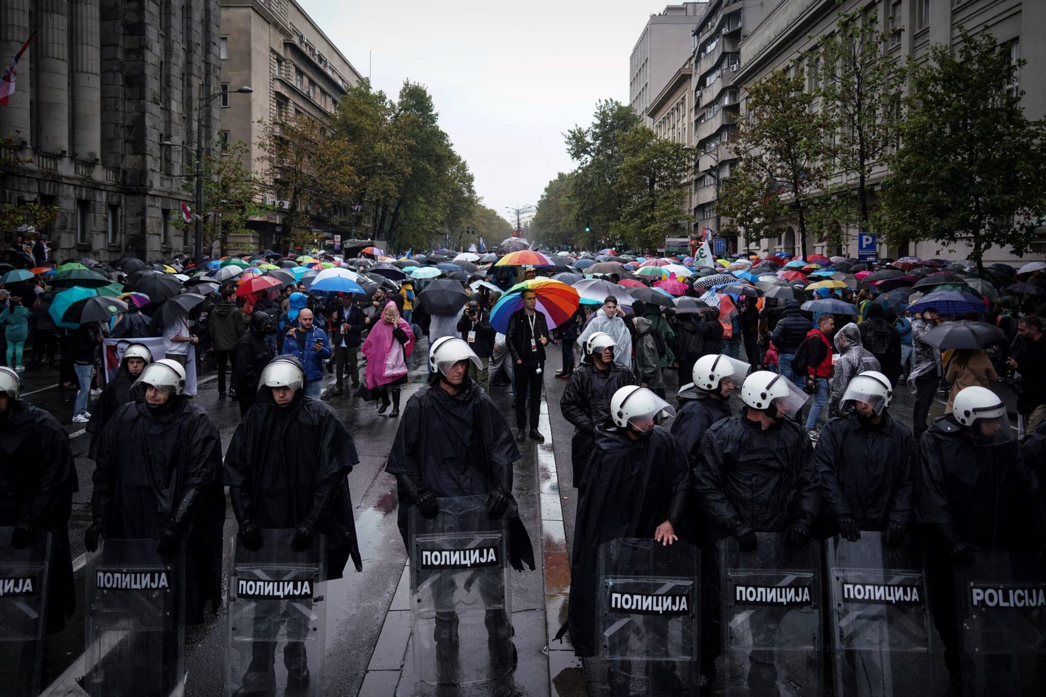Police officers secure LGBT Activists during a pride march in front of the Constitutional Court. 
