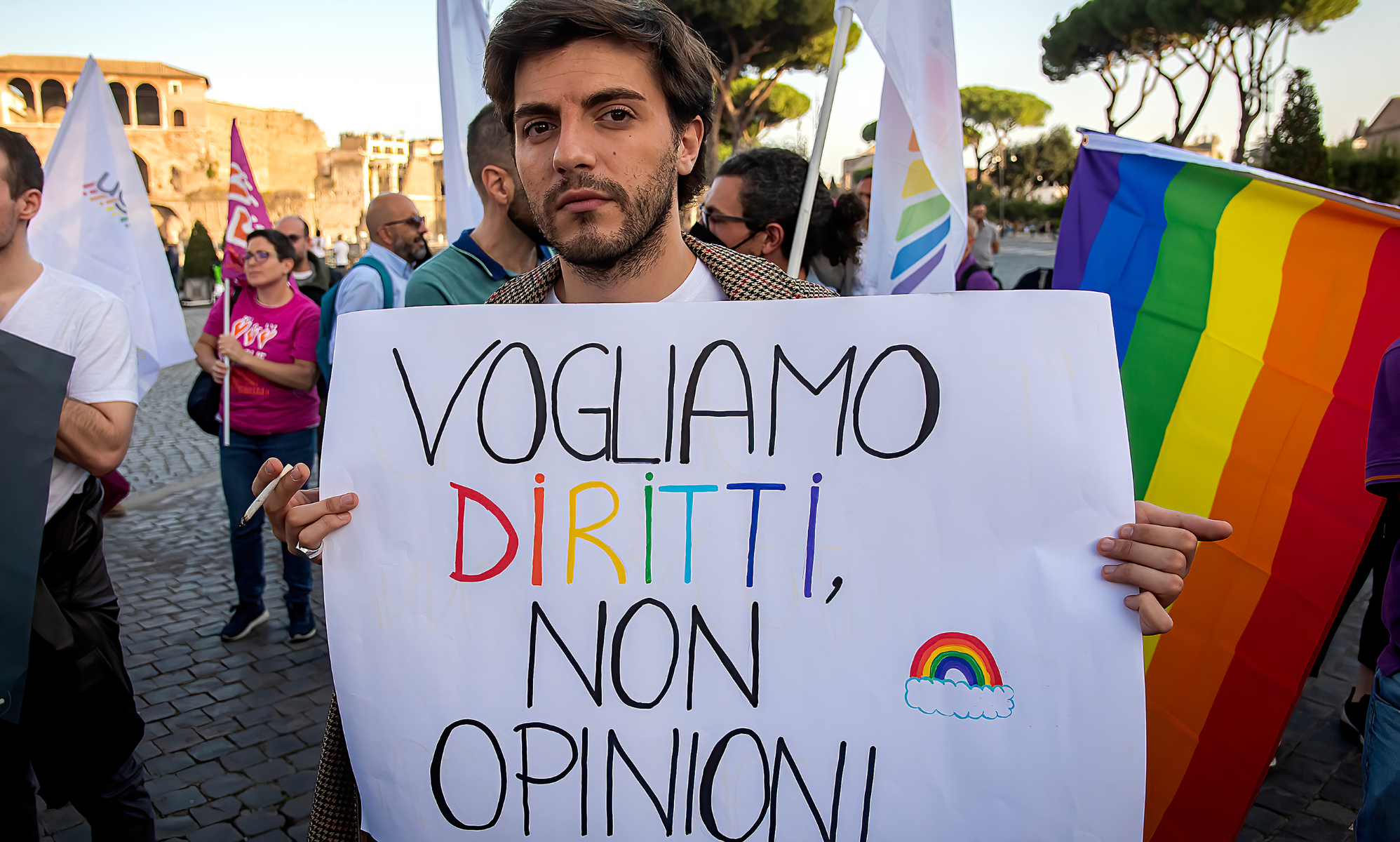 A protester holds a sign that reads: &quot;We want rights not opinions&quot; during a rally in support of the Zan bill, which would have criminalised anti-LGBTQ+ violence and discrimination in Italy