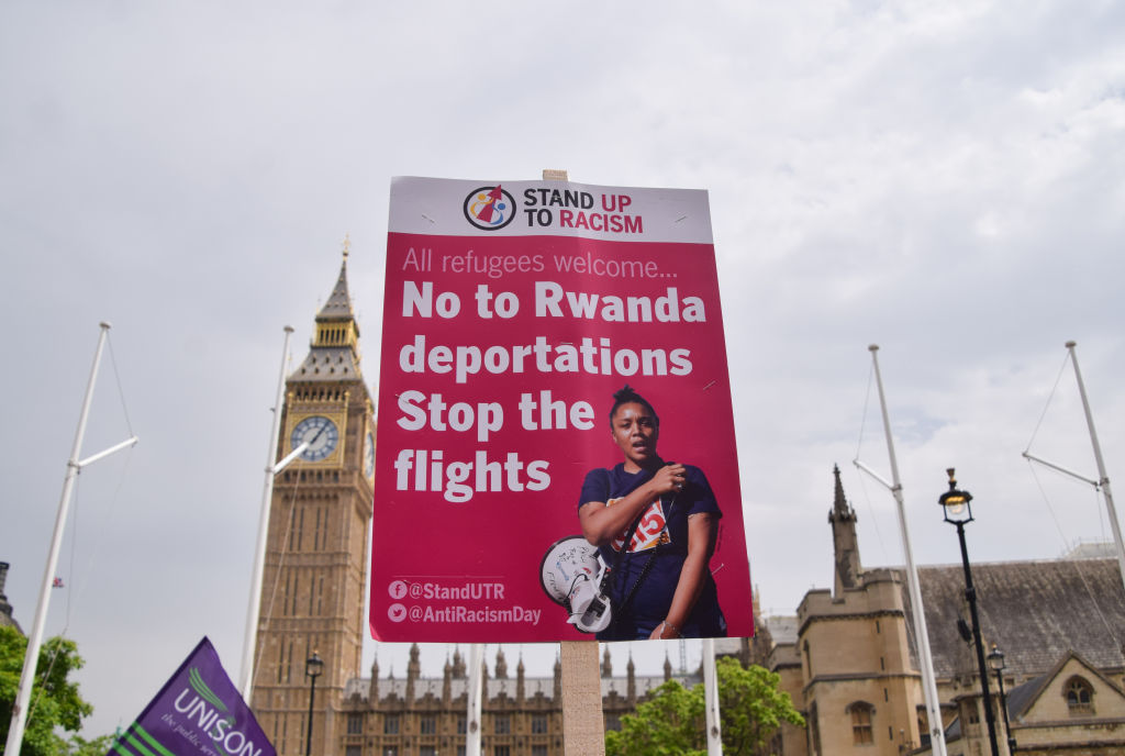 A placard opposing the deportation of refugees to Rwanda is seen during a demonstration in Parliament Square. The placard reads &quot;No to Rwanda deportations. Stop the flights&quot;.
