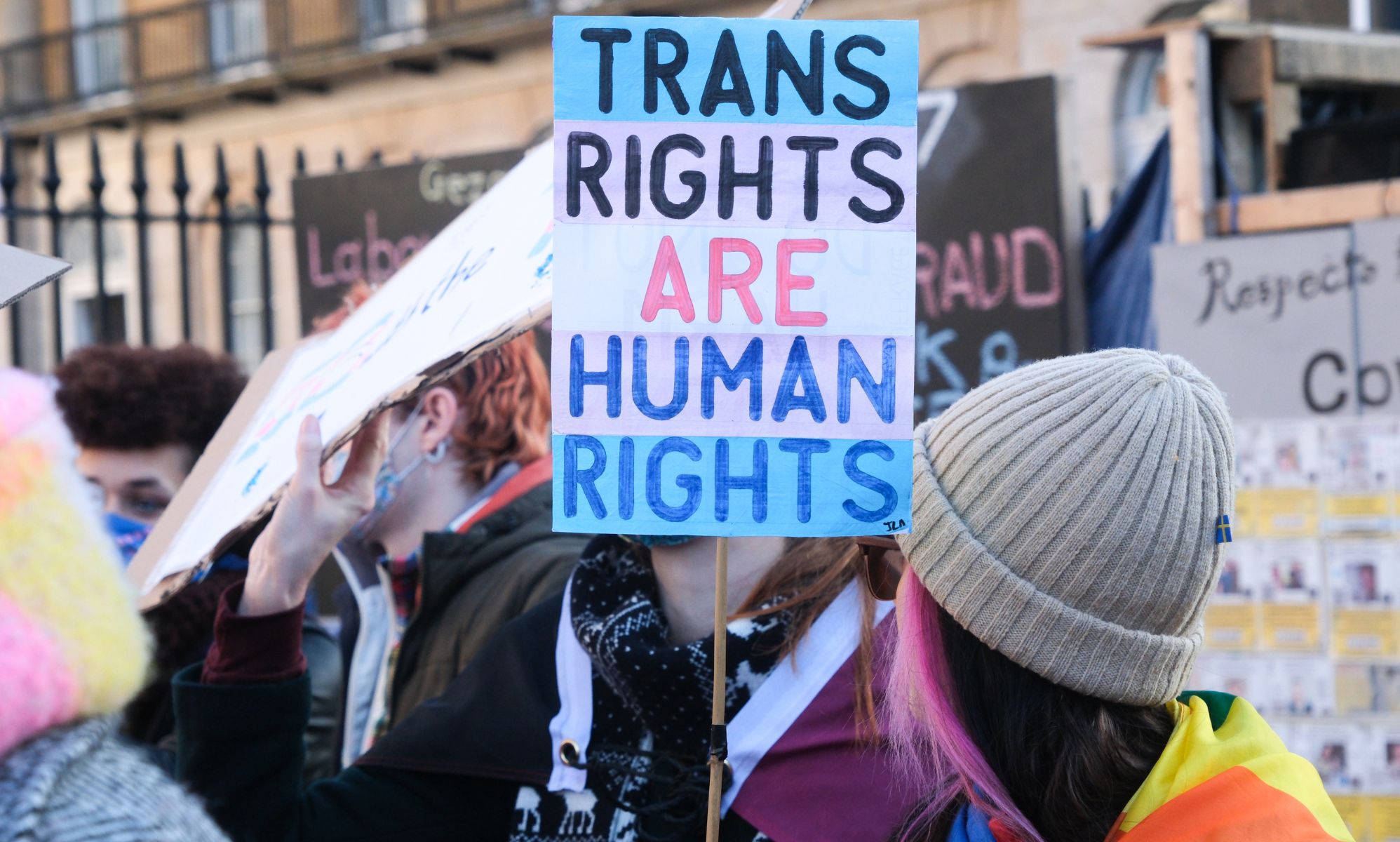 A trans rights supporter holds up a sign reading &quot;Trans Rights are Human Rights&quot; during a protest against the UK Goverment Section 35 stopping Scotland