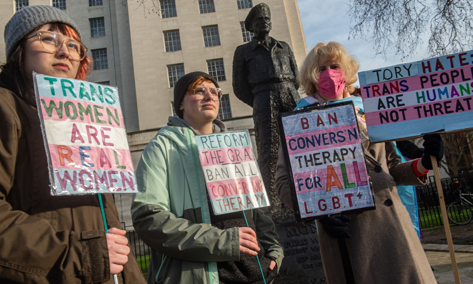 Trans rights activists protest opposite Downing Street after the UK government announced it will use a Section 35 order to block Scotland
