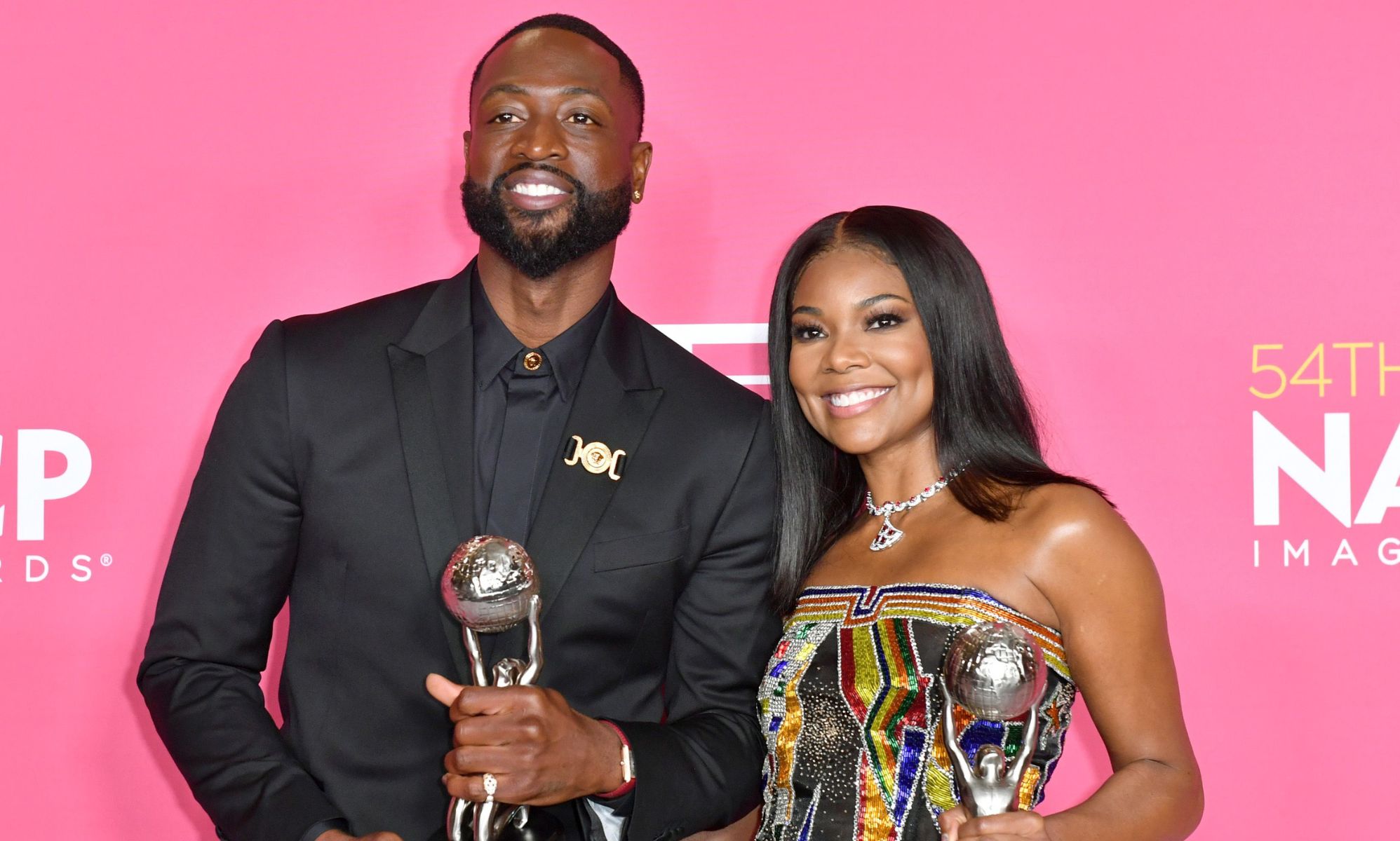 Dwyane Wade and Gabrielle Union accept the NAACP President