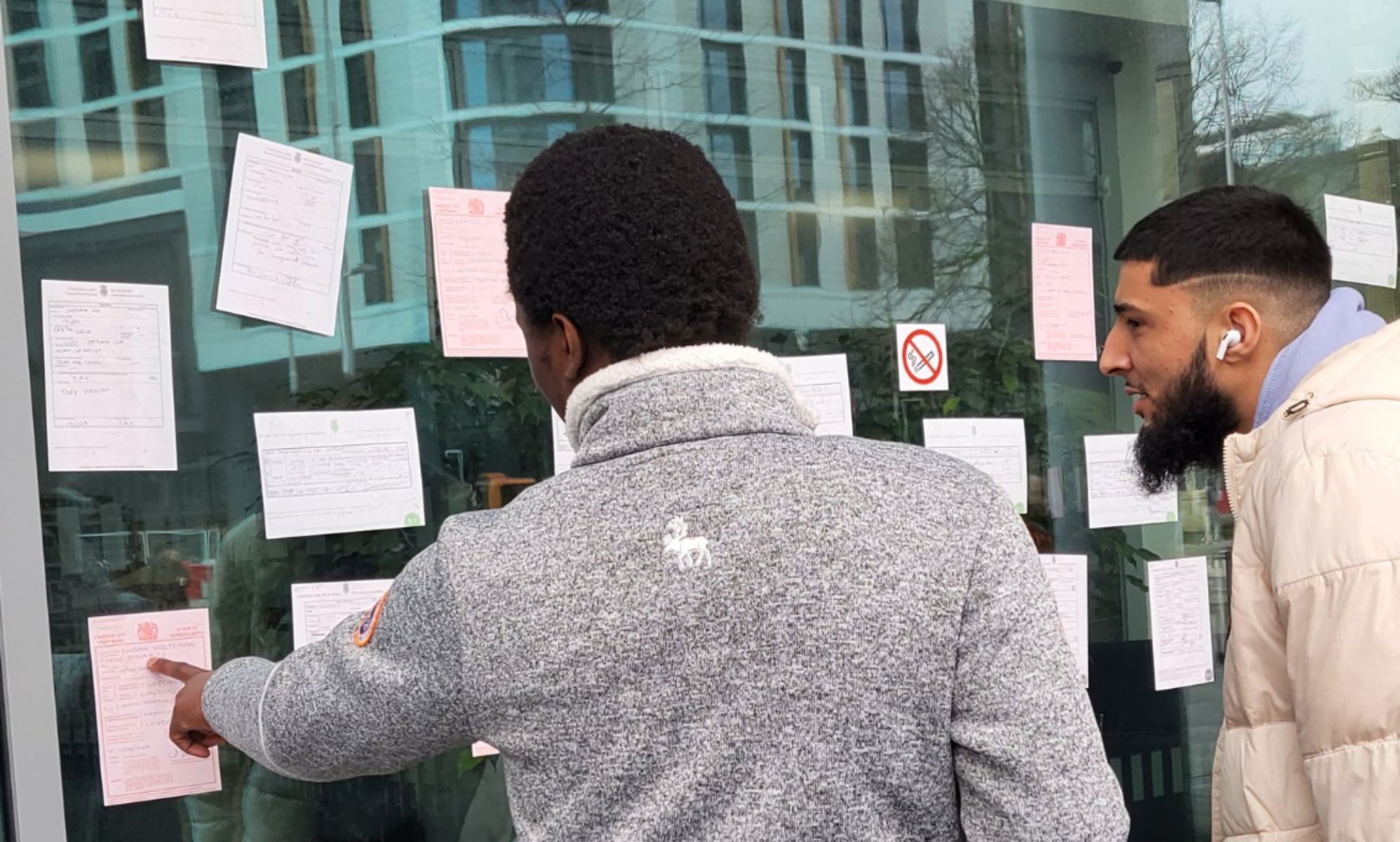 Birth, death and marriage certificates plastered over government building in protest over gender laws