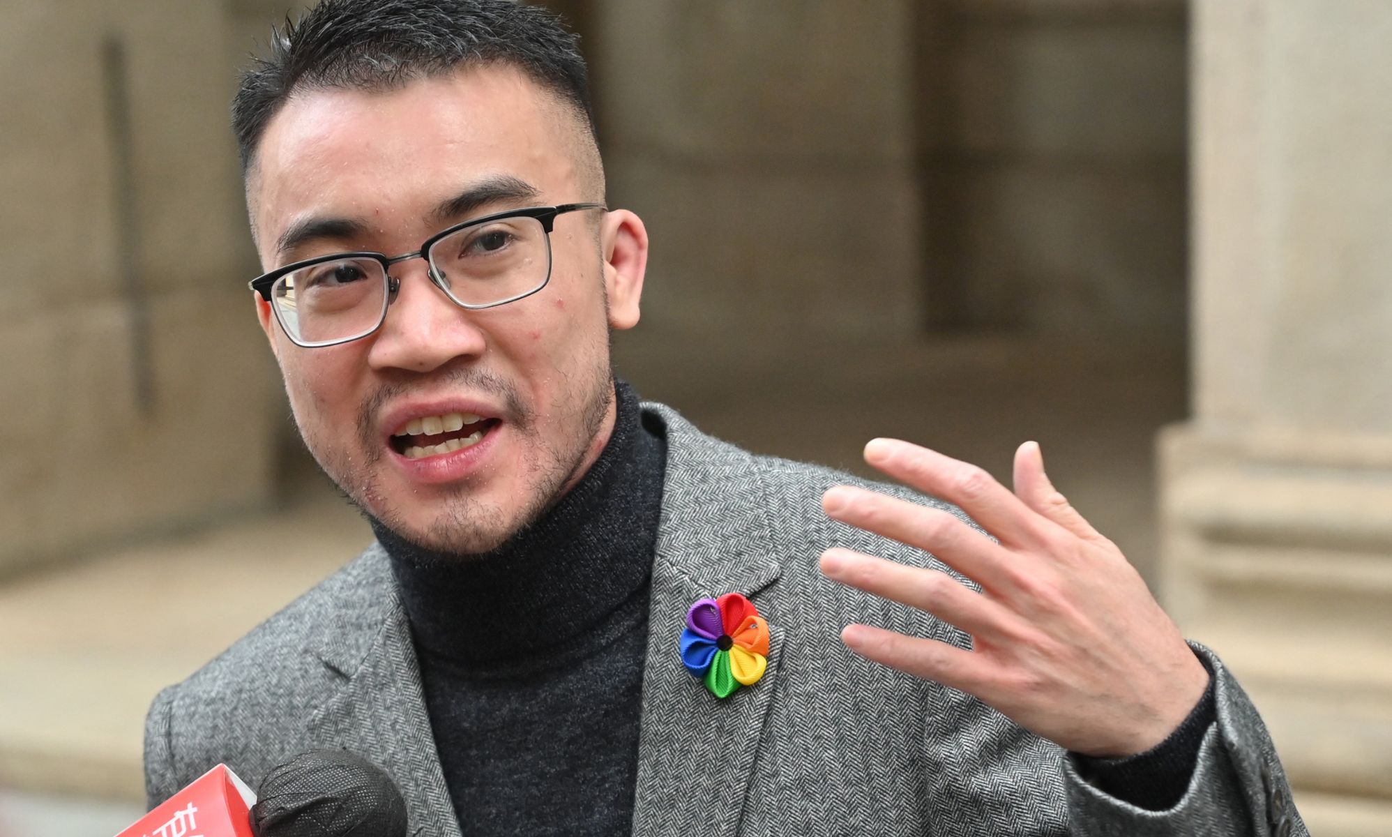 Trans activist Henry Edward Tse talks to the press outside Hong Kong