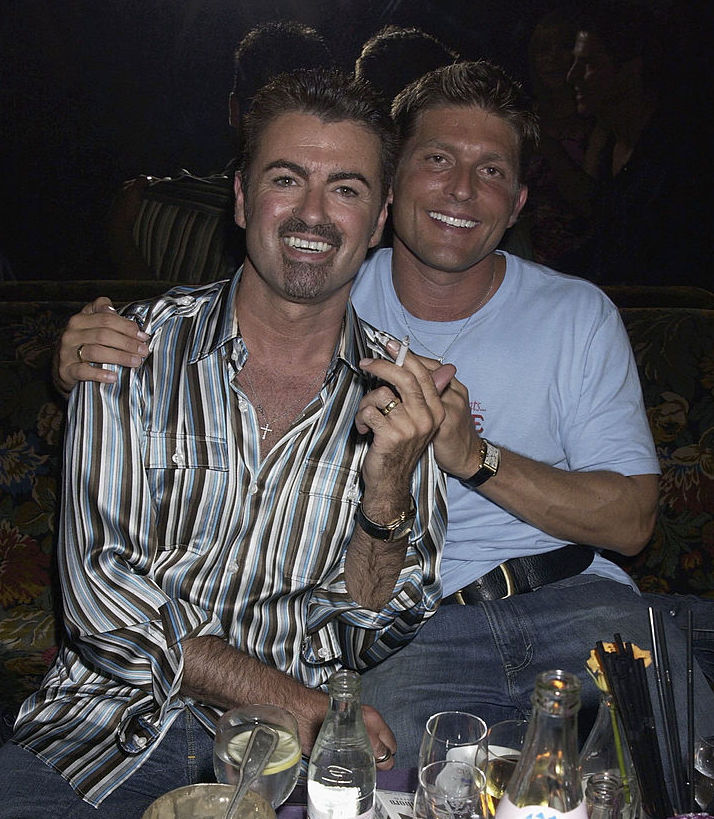 George Michael and partner Kenny Goss attend the Versace Couture Launch Party, thrown by Donatella Versace at The Ritz Hotel on 9th July 2002, in Paris. 