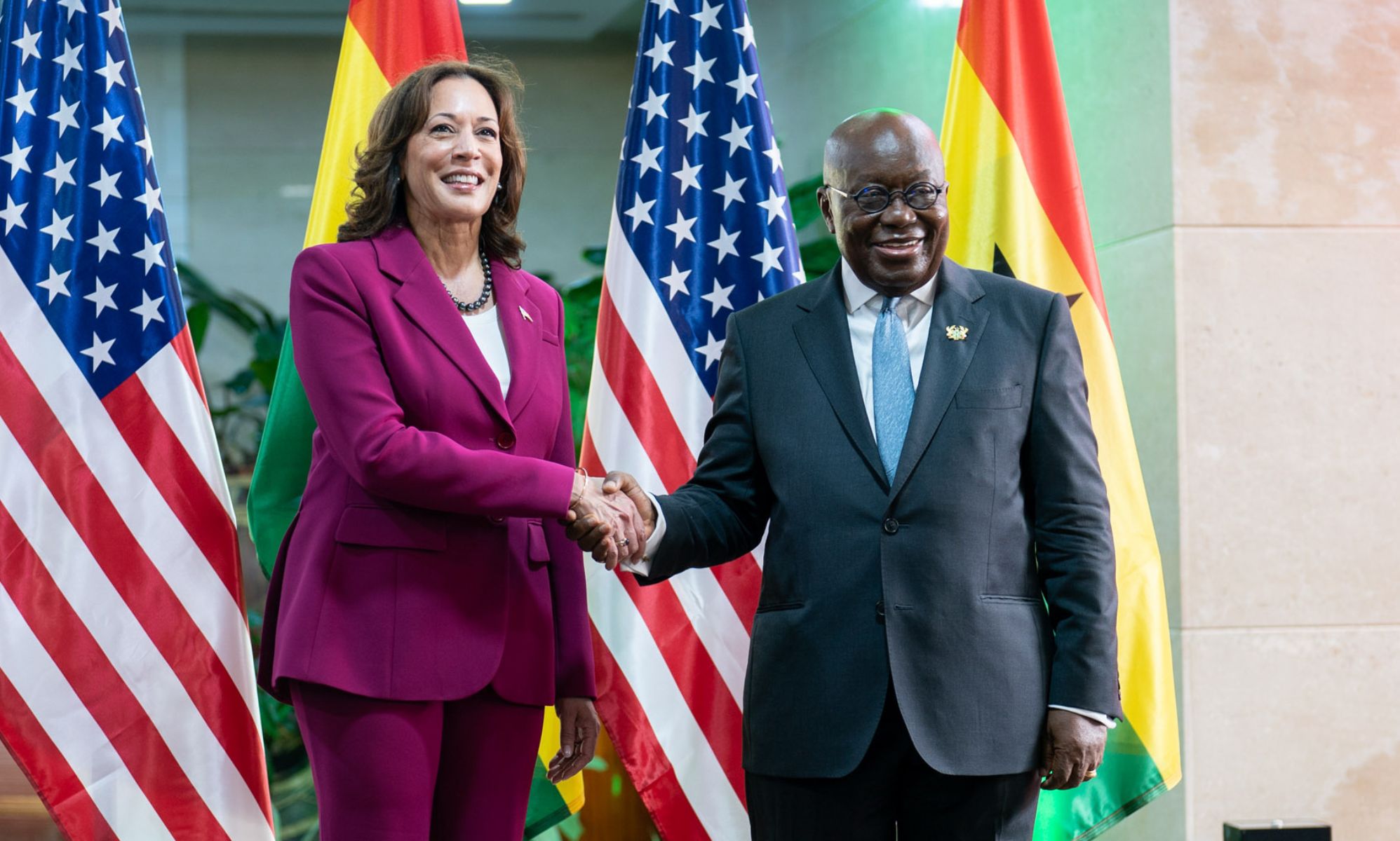 Kamala Harris stands alongside Ghana president Nana Akufo-Addo.