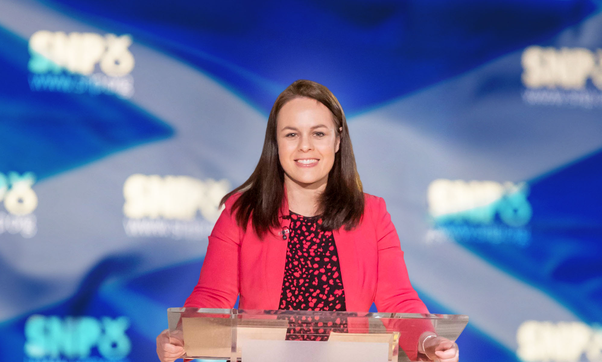 Kate Forbes in front of an SNP banner