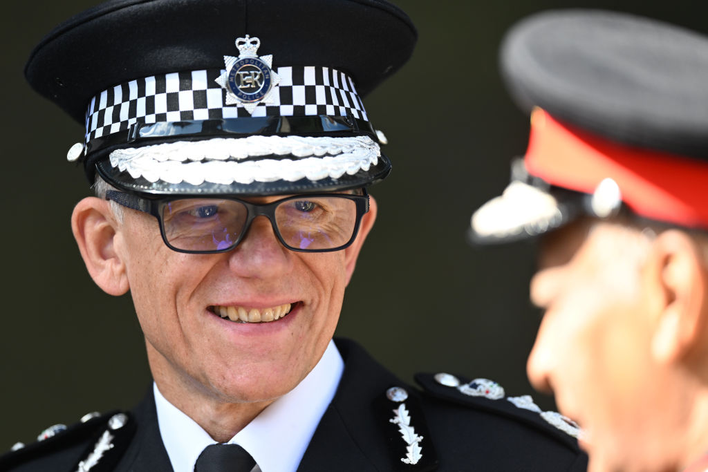 Metropolitan Police Commissioner Mark Rowley smiles during a visit from Britain