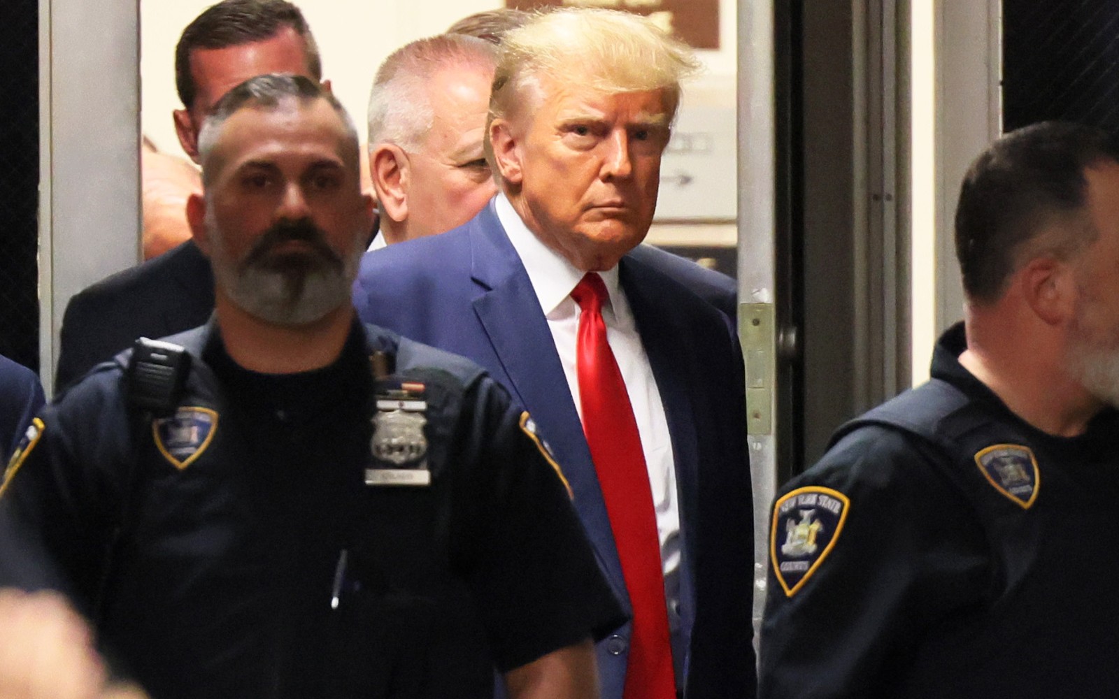 Gay couple ties the knot at courthouse moments before Donald Trump shows up to be arraigned