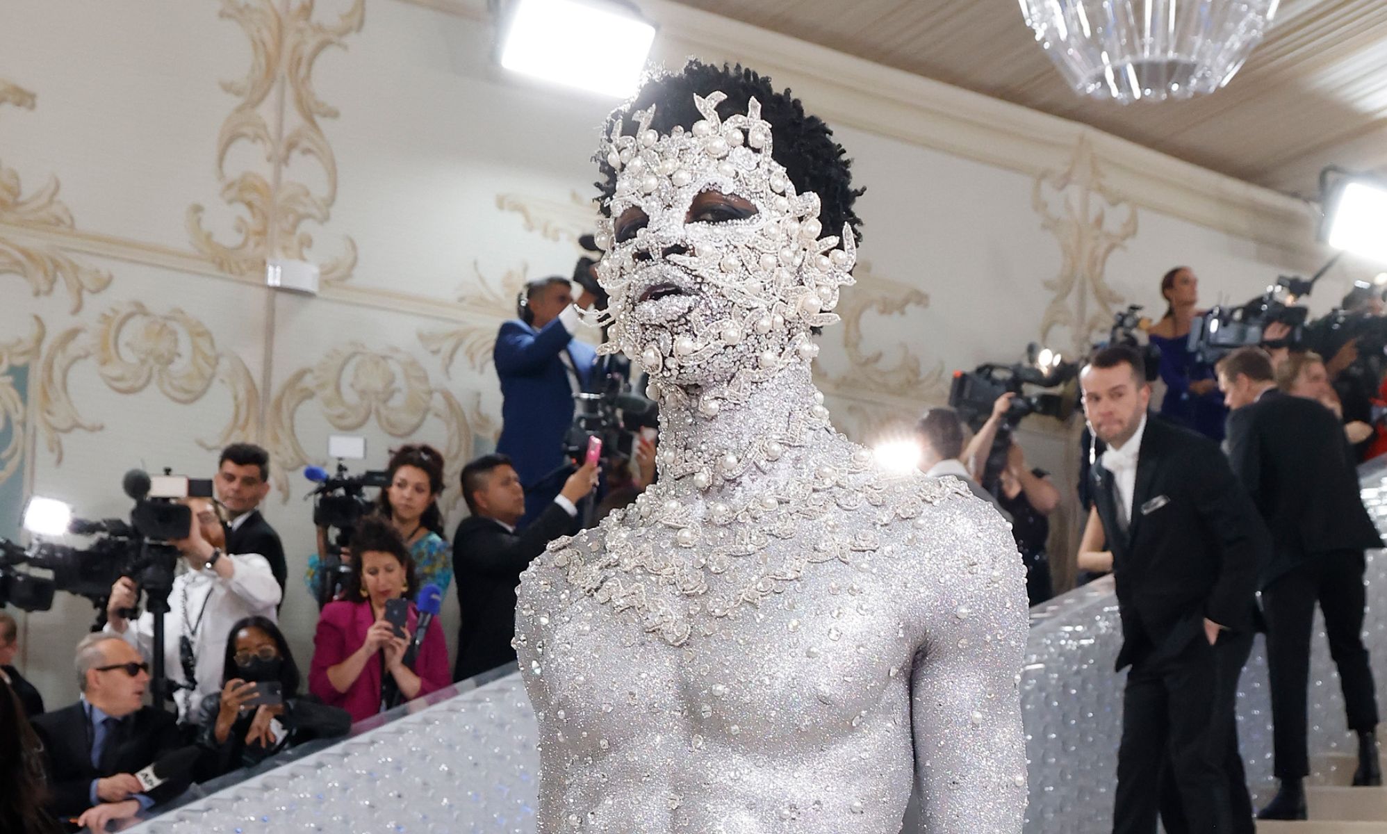 Lil Nas X wears nothing but a silver thong and body paint to Met Gala – and fans are divided