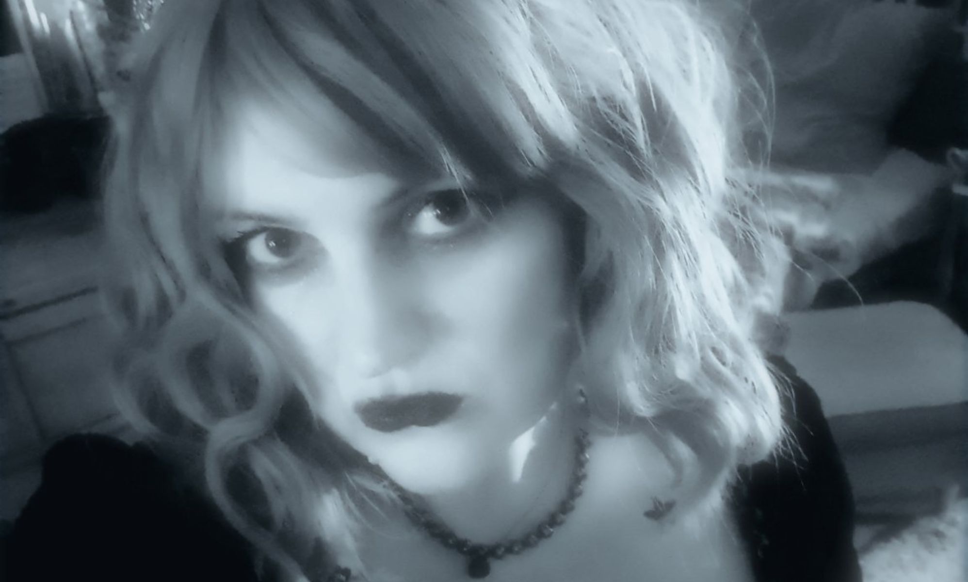 Mélanie, a Princess Diana stan, pictured in a black and white selfie wearing a tiara.