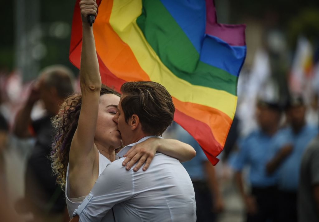 Two women kiss as they take part in the Bucharest Pride 2018. 