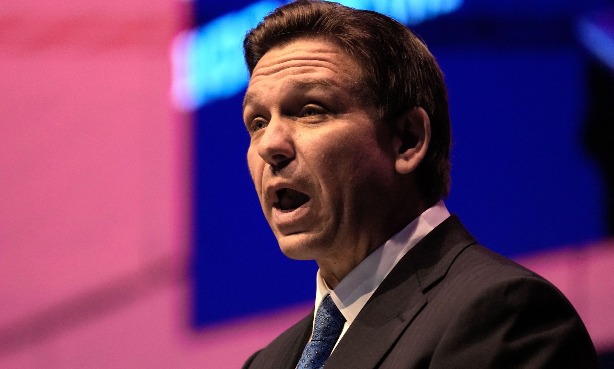 Republican governor Ron DeSantis, who has launched his 2024 presidential campaign, wears a suit and tie as he speaks to someone off camera