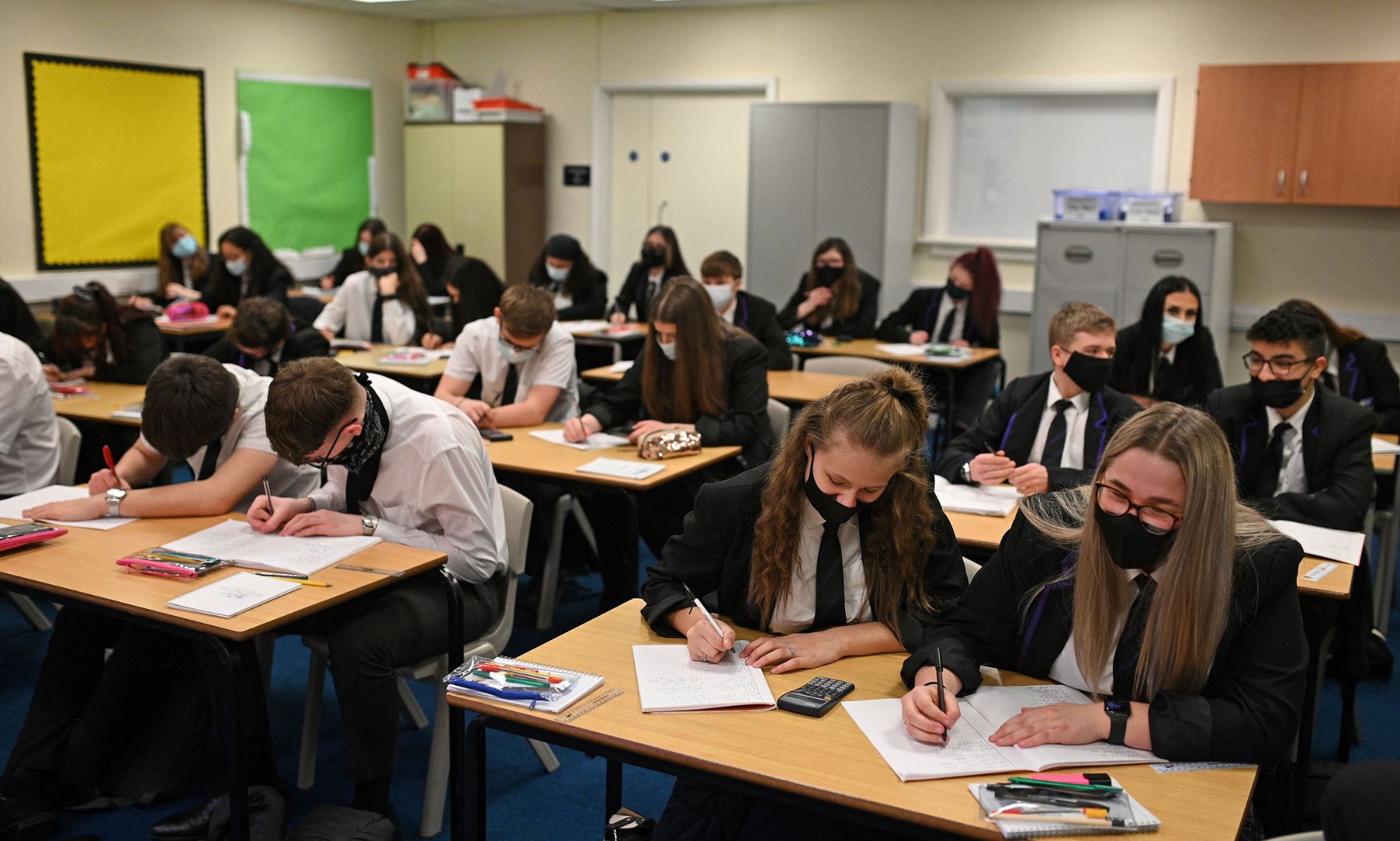 A group of students in a UK school gather together to take their GCSEs