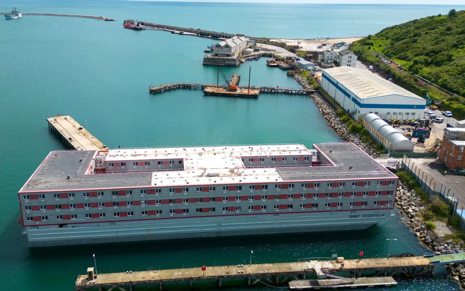 Government urged not to house LGBTQ+ refugees on 'barbaric' migrant barge