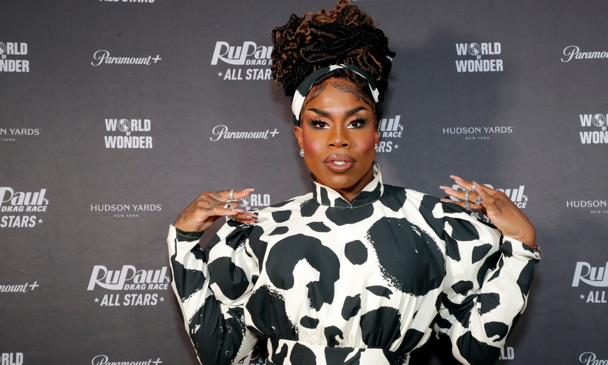 Monet X Change in a cow print dress at the red carpet premiere of Drag Race All Stars 7.
