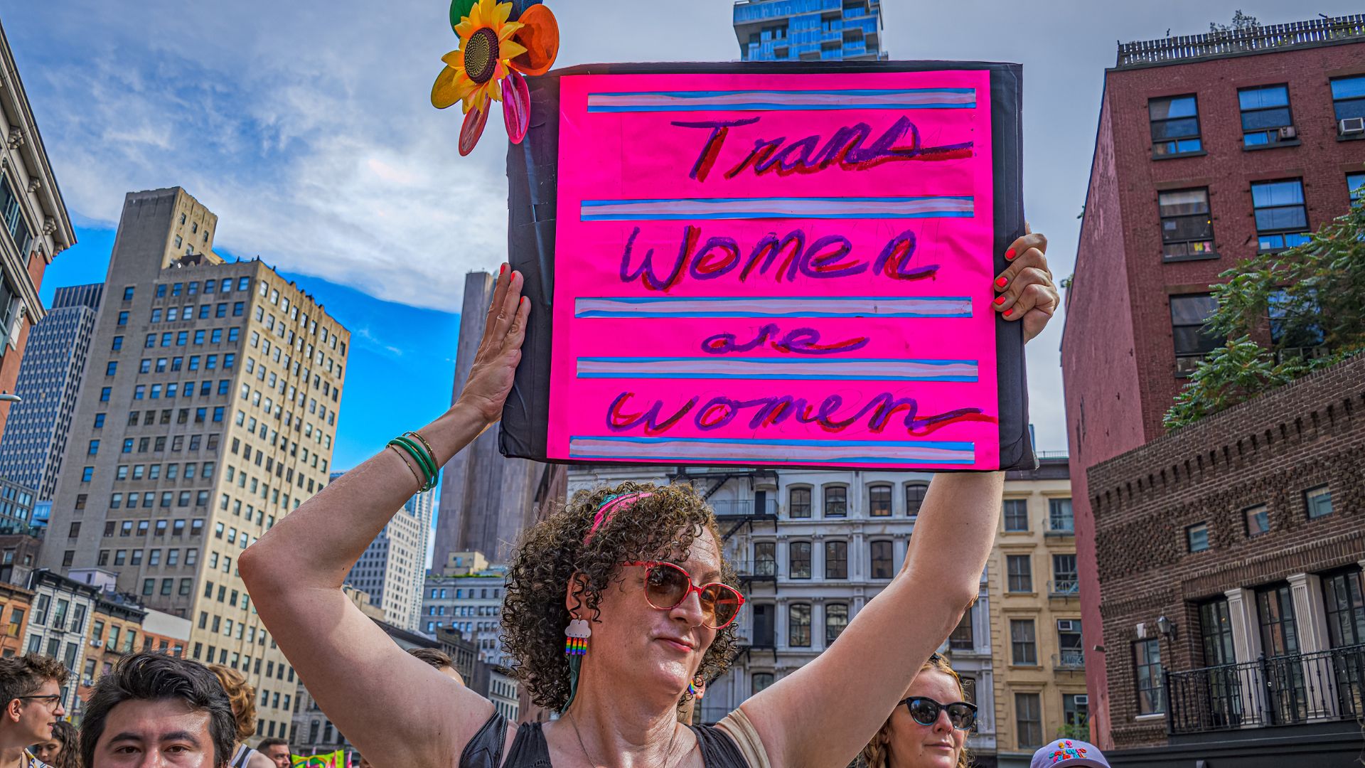 Protester holds a sign reading &quot;trans women are women&quot; at the Queer Liberation March in Manhattan, New York on 25 June 2023