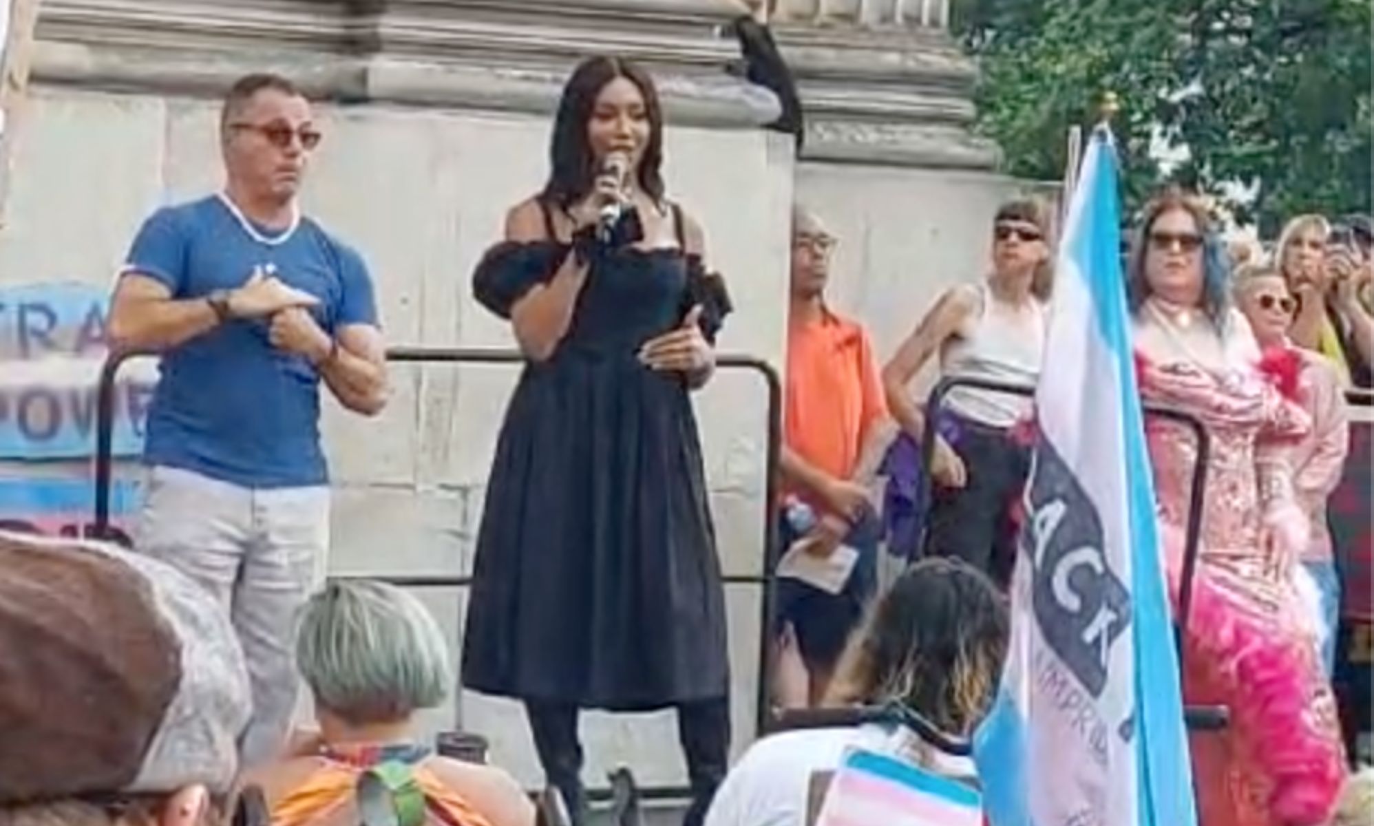 Trans activist, model and writer Munroe Bergdorf wears a black dress as she speaks to a crowd gathered for London Trans+ Pride