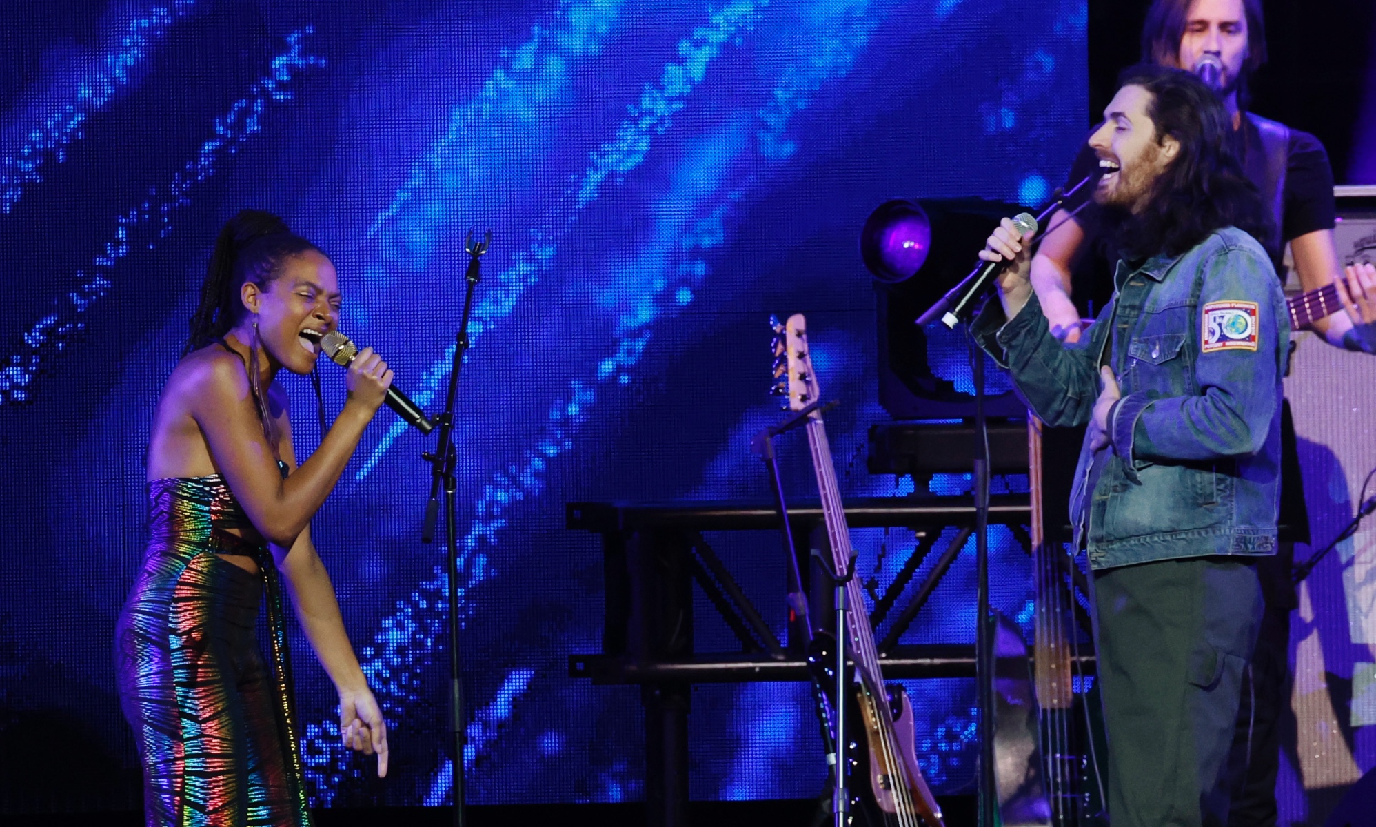 Allison Russell (L) performs with Hozier (R) at Love Rising benefit. 
