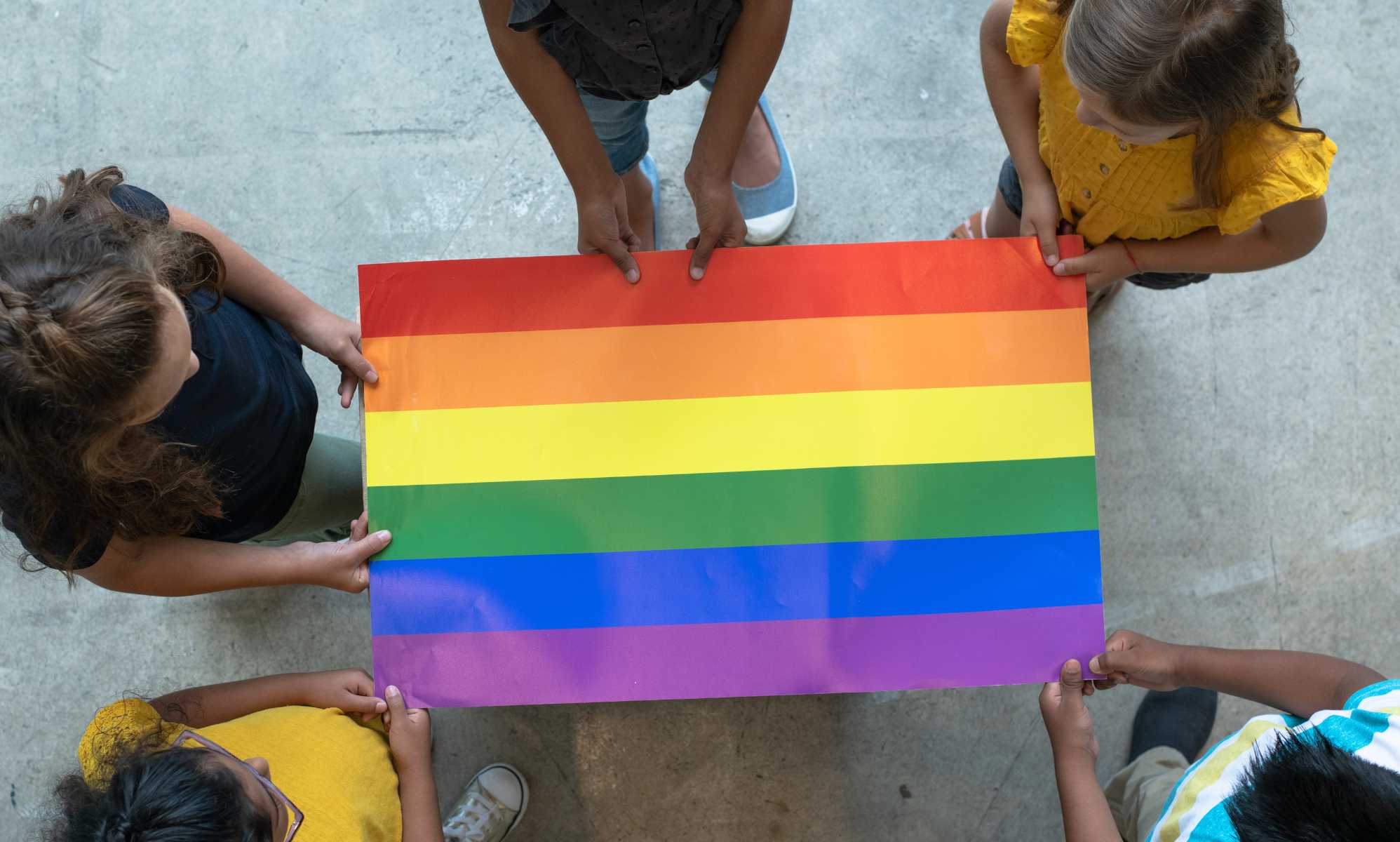 School-age children with Pride flag