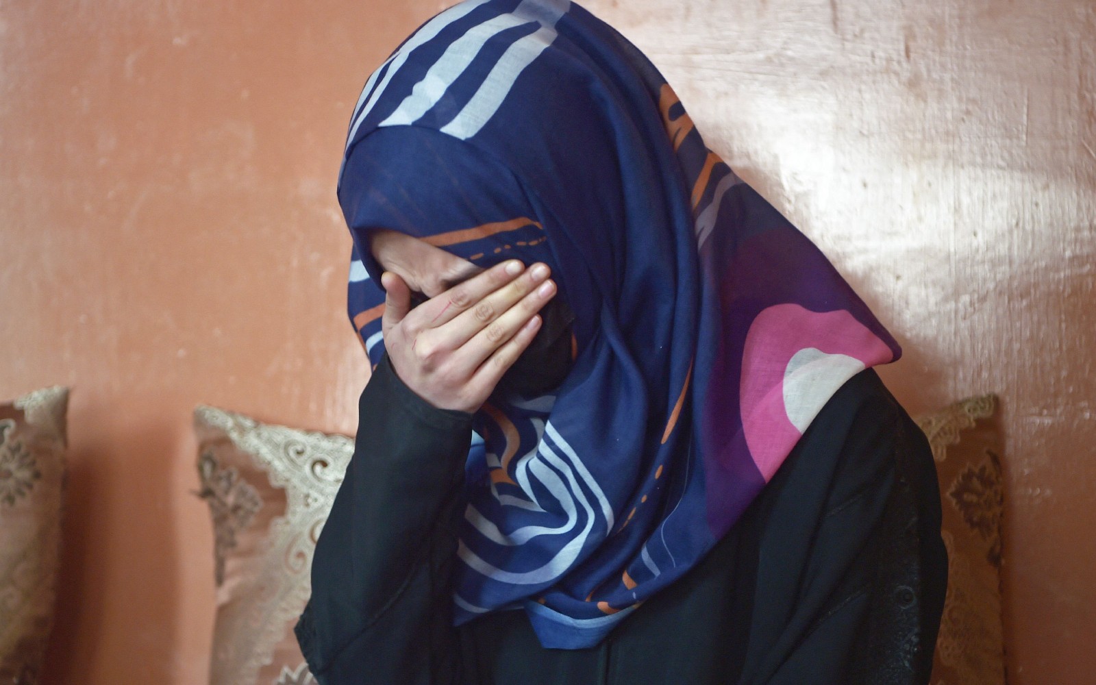 How do the Taliban, who 'know what a woman is', treat women in Afghanistan?